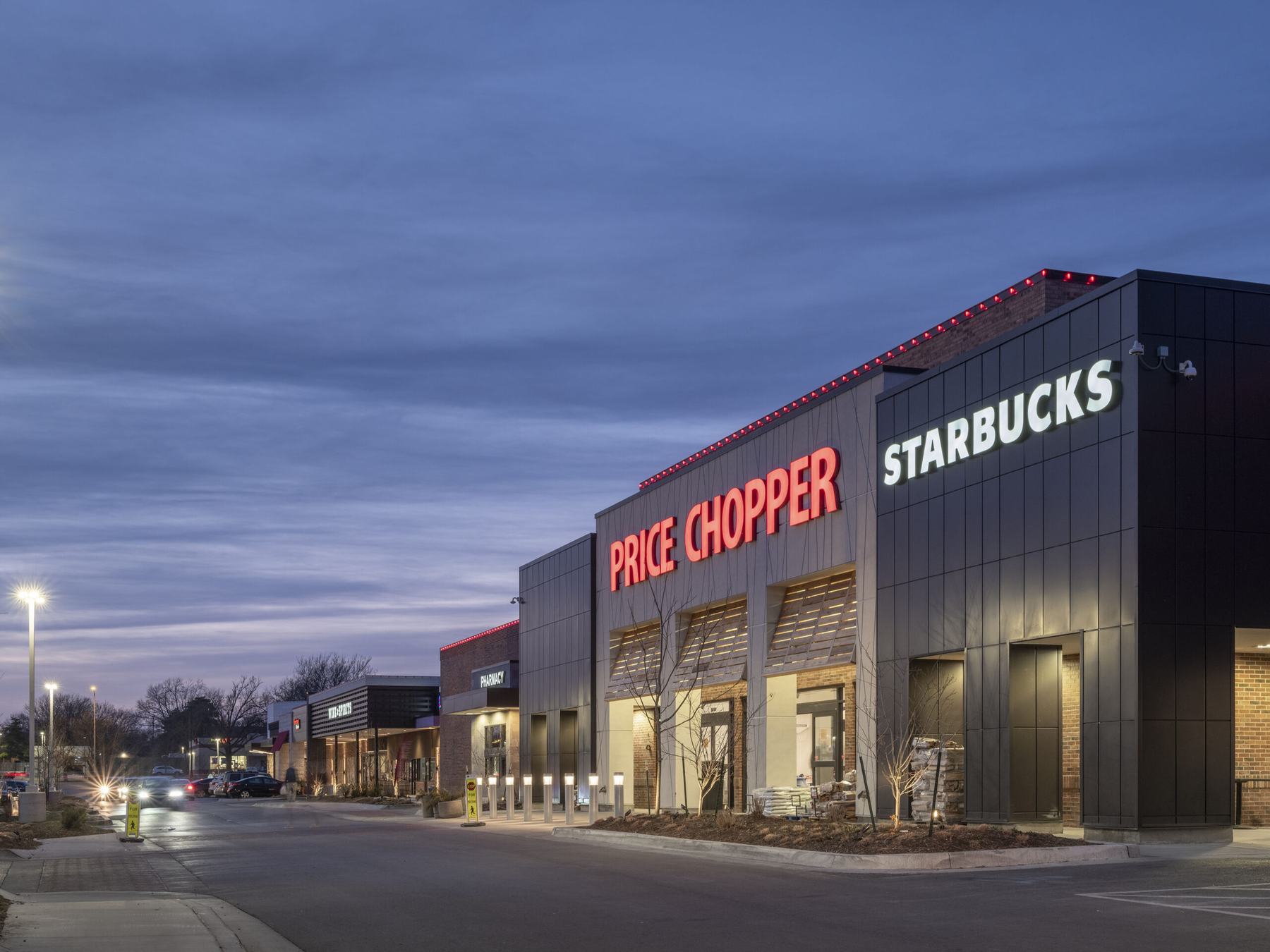 Ranch Mart North grocery-anchored retail center at 95th and Mission Road in Leawood, Kansas, with Price Chopper and Starbucks storefronts lit at dusk