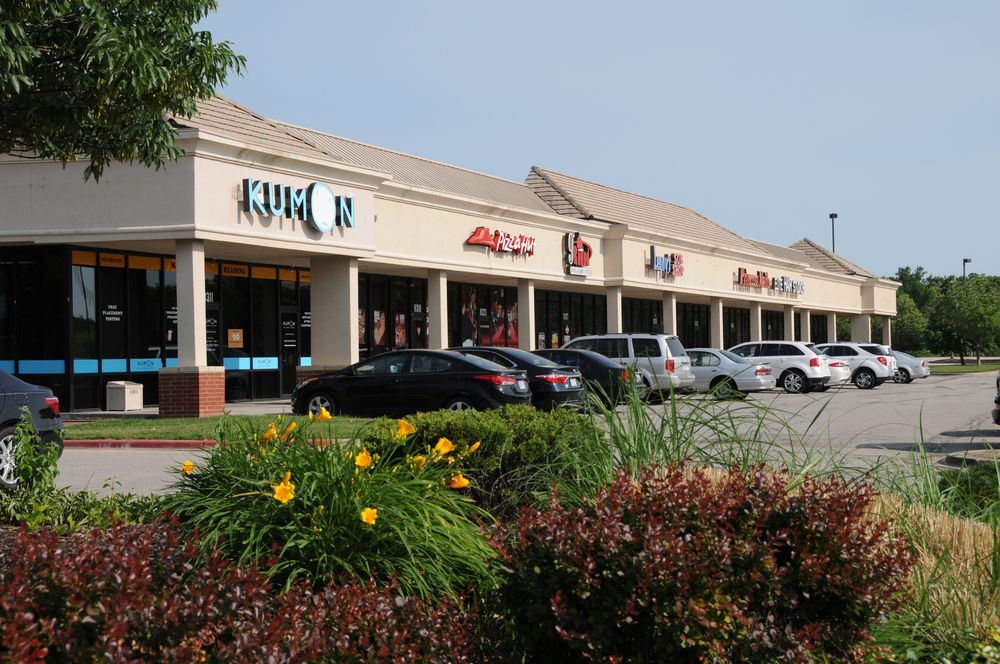 Village Shops retail center in the Overland Pointe development, sold with Graystone representing the seller